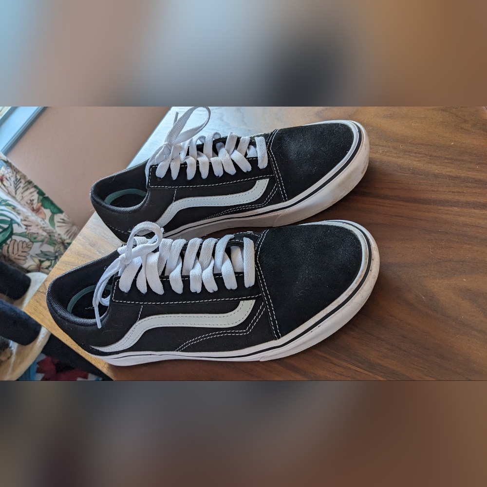 Black suede Vans Old Skool sneakers